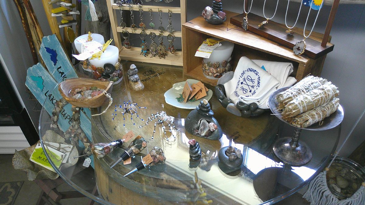 Lake Superior beach stone art and candles displayed on the corner counter